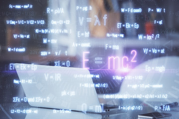 Desktop computer background and formula hologram writing. Double exposure. Education concept.