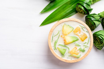 Thai dessert (Lod Chong), rice flour pandan flavor and sliced melon fruit in coconut milk