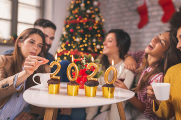 Friends drinking coffee on Christmas morning