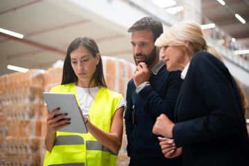 Managers checking the list of products