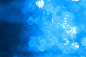 Blue background with blinking stars. Holiday abstract texture.