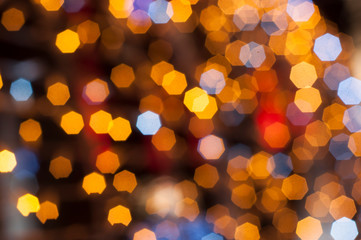 Christmas holiday festive glittering defocused colorful background with bokeh lights