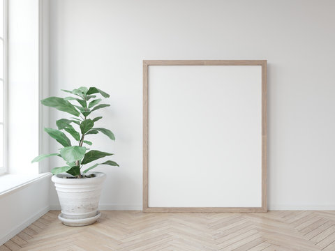Mock up poster with vertical wooden frame standing on wooden floor with green plant in white pot. Scandinavian frame mockup. 3D illustrations