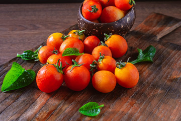 Fototapeta na wymiar .Fresh tomatoes on wooden background