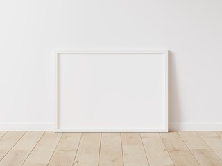 Horizontal white frame mockup. Wood frame on wood floor. 3d illustrations.