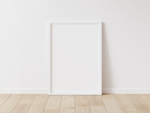 Vertical white frame mock up. Wooden frame poster on wooden floor with white wall. 3D illustrations.