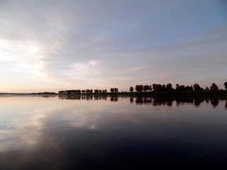 Obraz premium sunset over the river