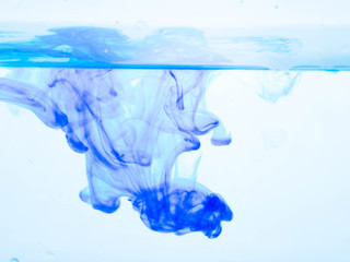 Blue ink dissolved in water.