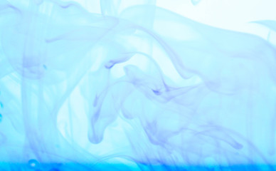 Fototapeta na wymiar Blue ink dissolved in water.
