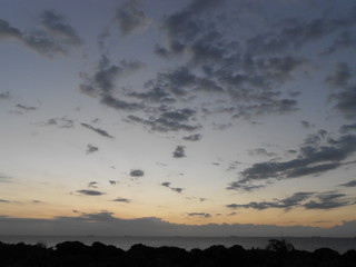 Scattered clouds with sunset seascape