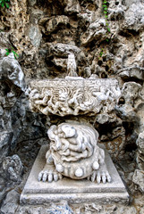 Fototapeta na wymiar Ancient stone fountain in the imperial garden of the Forbidden City