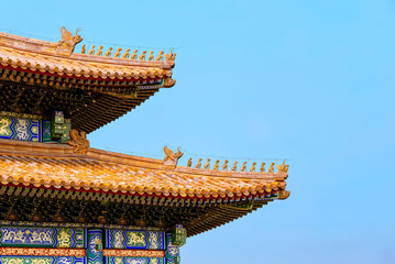 The Imperial Palace in Beijing (Forbidden City). curved roofs in traditional Chinese style with...