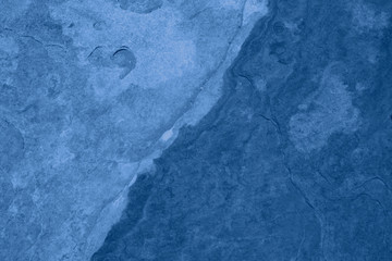 Trend color 2020 classic blue, top view, layout for design. Mountain texture in trendy blue color. Trendy color concept of the year, classic blue background. Modern stylish, copy space.