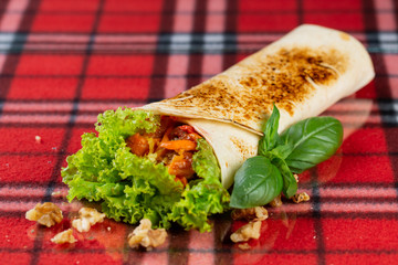  vegetable roll, fresh vegetables, cheese, chili peppers and cherry tomatoes. veggie roll