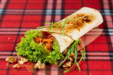  vegetable roll, fresh vegetables, cheese, chili peppers and cherry tomatoes. veggie roll