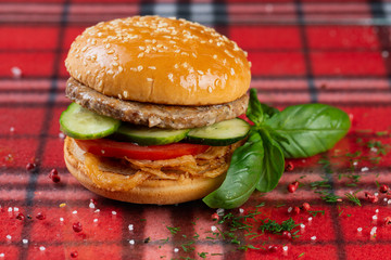  beef burger with cheese, fresh tomatoes and cucumber, onions. sesame seed bun
