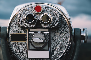 Binoculars placed against evening sky