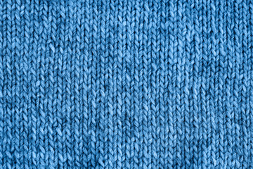 Blue knitted texture. Handmade Knitwear. Color of the year 2020 classic blue toned. Background