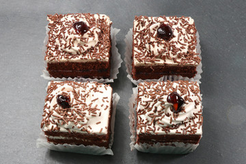 chocolate cake slices on gray texture background - isolated - 