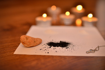  Lighted candles and paraphernalia for the magic rite.