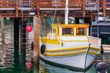 Fototapeta na wymiar Small Fishing Boat at Harbor