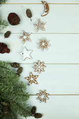 Christmas gingerbread cookies with new year decorations on white wooden background. Holidays, christmas, dessert, new year food, design elements conceptconcept