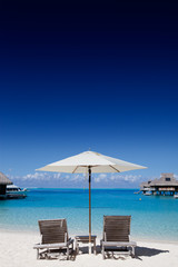 Two beach chair on the seashore