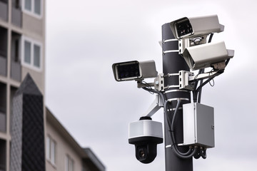 modern camera surveillance tower in the city