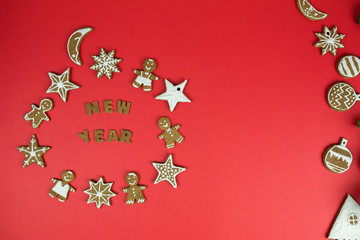 Christmas gingerbread cookies with new year decorations on red background. Holidays, christmas, dessert, new year food, design elements conceptconcept