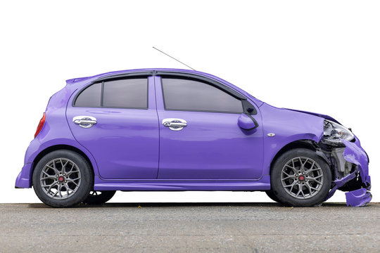 Purple color car big damaged and broken by accident on city street parking can not drive any more. Save with clipping path.