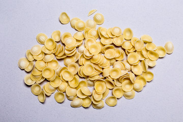 classic orecchiette italian raw pasta on white background