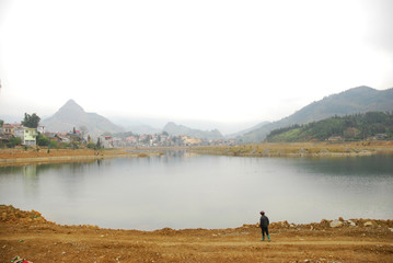 Obraz na płótnie Canvas Beautiful lakeside at Sapa, Vietnam. Lao Chai Village is one of the most imposing landmarks of Sapa which is home to the Black H'mong. 
