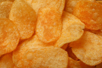 Potato chips textured background, closeup and space for text