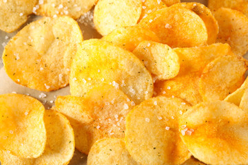 Potato chips textured background, closeup and space for text