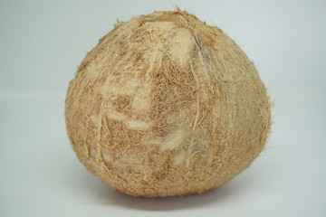Peeled coconut over white background