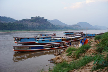 Fototapeta na wymiar Beautiful Mekong river with boats parking at the side.