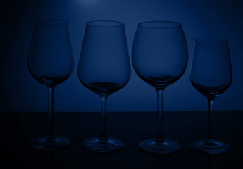 Wine glasses on blue
