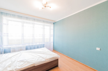 Russia, Omsk- August 02, 2019: interior room apartment. standard repair decoration in hostel. bedroom with bed