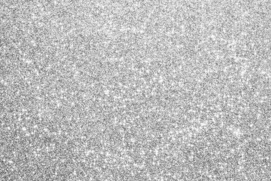Abstract silver glitter sparkle defocused light background