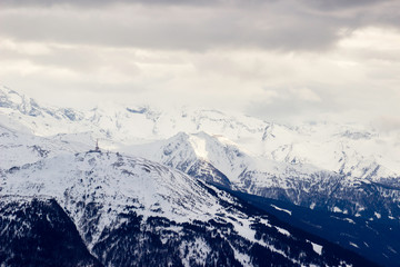 Fototapeta na wymiar Snow capped mountains in the austrian alps