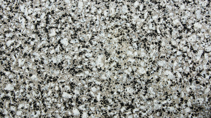 Wall formed of small stones of white and black colors to use as 