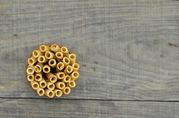 Vanillia waffle roll stick in bowl wooden, top view