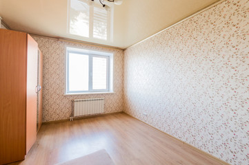 Russia, Omsk- August 02, 2019: interior room apartment. standard repair decoration in hostel. bright empty room without furniture