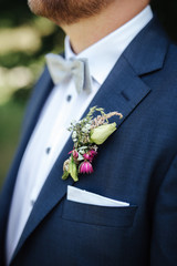 groom wearing a boutonniere