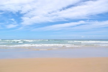 Sandy beach and dramatic waves in Gold Coast Australia.