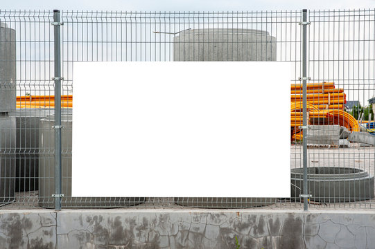 Blank White Banner Mockup On The Fence Of Construction Site