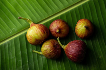 Fresh ripe figs closeup on a dark background