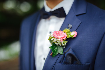 groom wearing a boutonniere