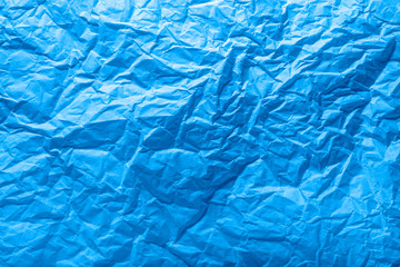 paper wrinkled texture toned by classic blue for background and copy-space. Color of the Year 2020