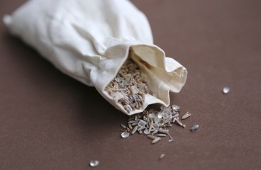 Bath-taking salt and lavender seeds for smell are spread on the table